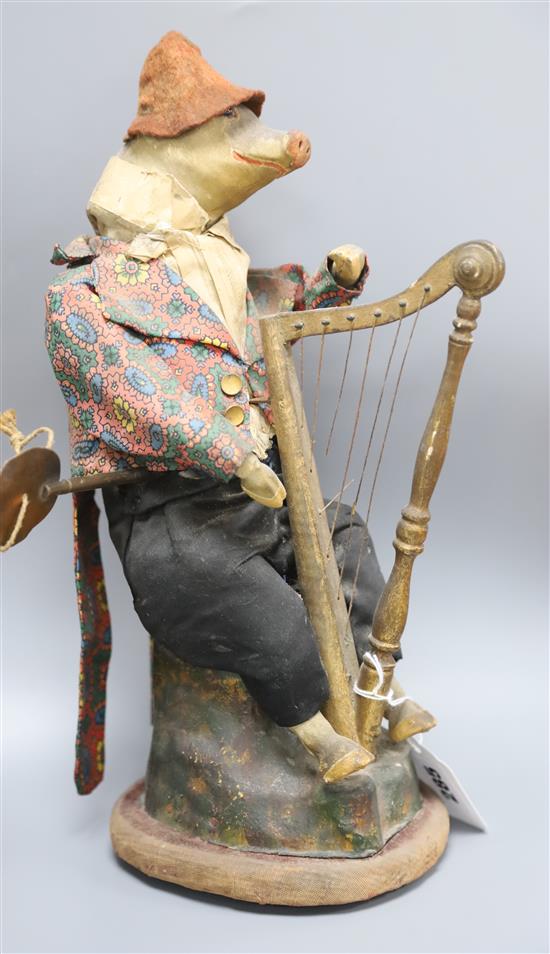 A French automaton of a pig playing a harp, late 19th century